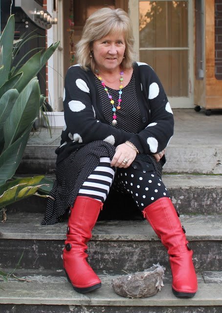 Sue is magnificent in her pattern mixed ensemble and those kick-ass red boots!!